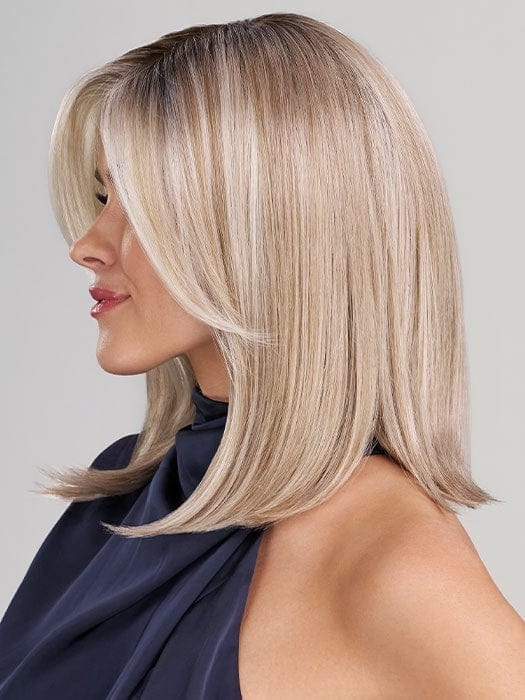 Model is wearing ELLE by JON RENAU in color 101/88/27S8 CATALINA BLONDE | Pale blonde with Pure White Natural Violet halo highlights, shaded medium brown