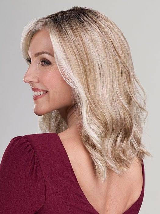 Model is wearing HEIDI by JON RENAU in color 101/88/27S8 CATALINA BLONDE | Pale blonde with Pure White Natural Violet halo highlights, shaded medium brown